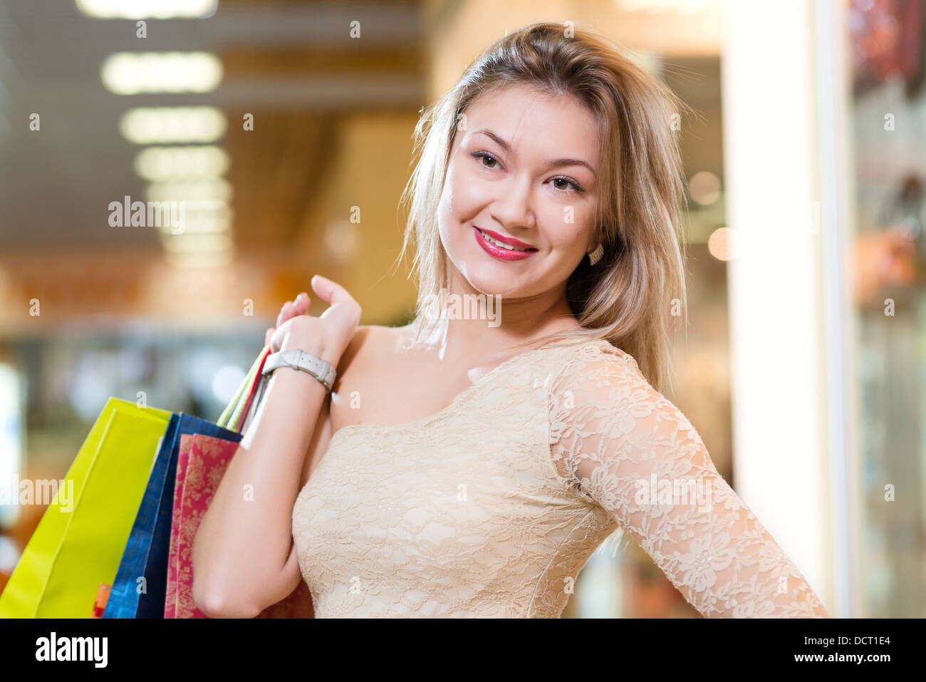 portrait of a beautiful woman in a shopping center Stock Photo - Alamy