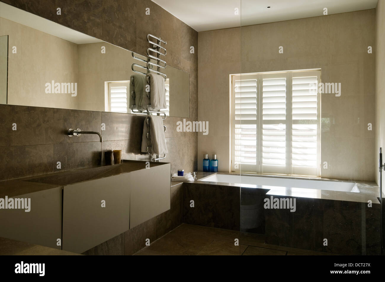 Sleek limestone bathroom Stock Photo Alamy