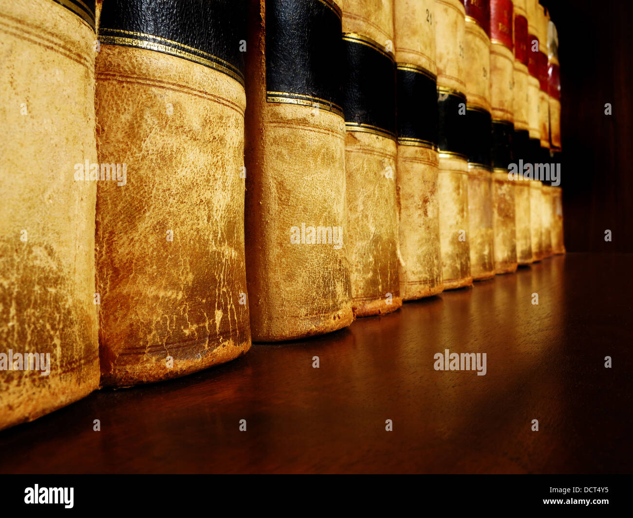 Row of old leather books on a shelf Stock Photo Alamy