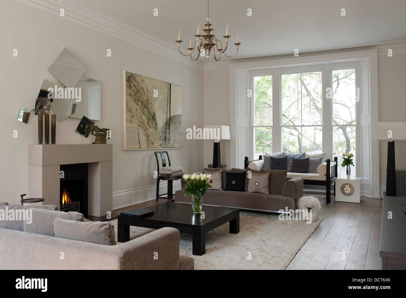 Open fire with neutral decoration in 19th century Kensington family home Stock Photo