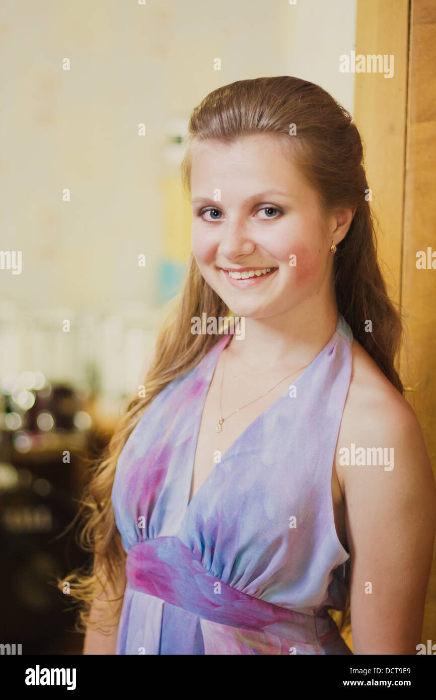 Close up Portrait Of Beautiful Smiling Girl In Dress Stock Photo