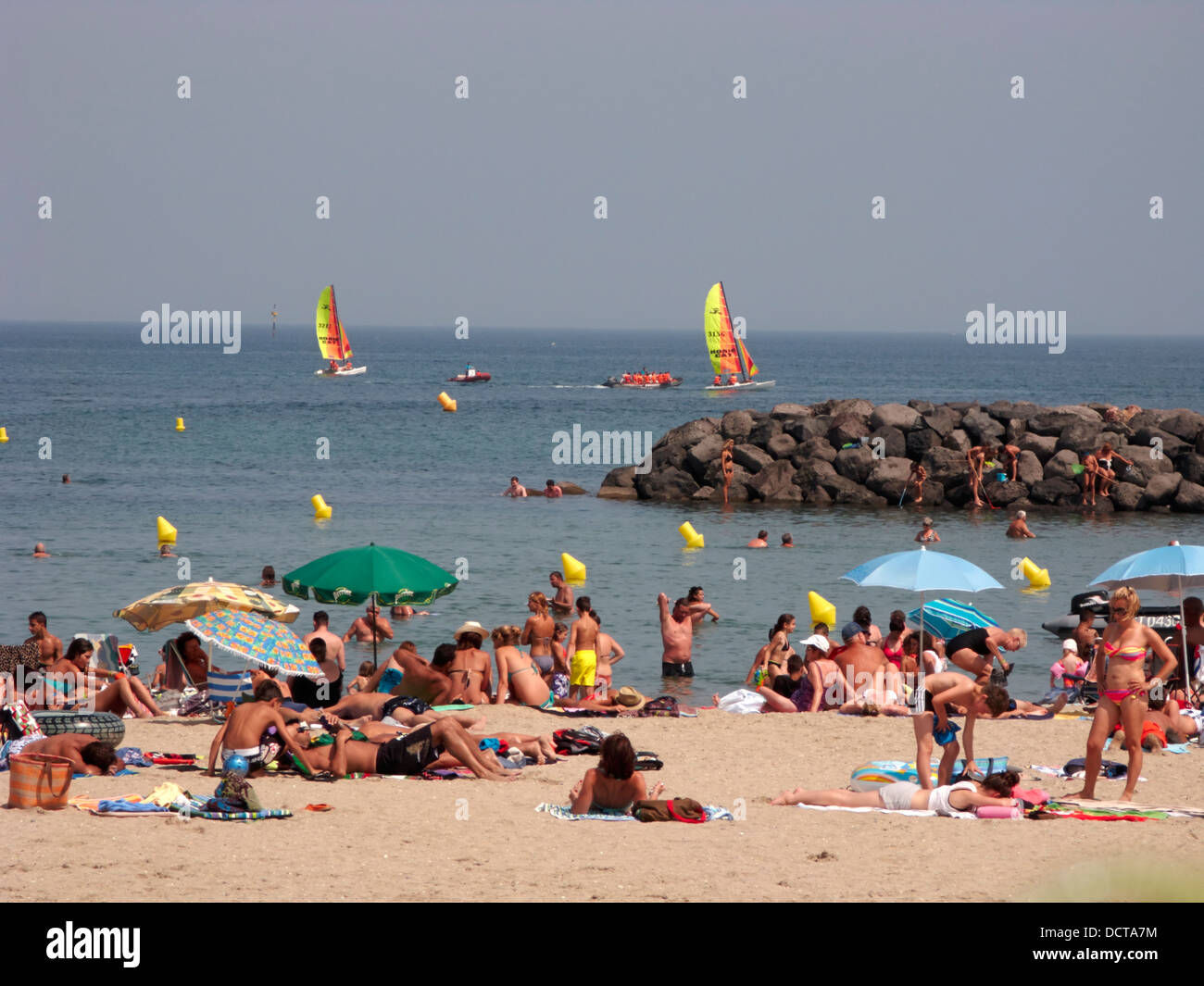 busy crowded beach at cap on the coast Stock Photo -
