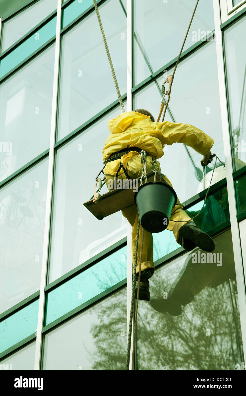 Window cleaner man climbing a skyscraper facade Stock Photo Alamy