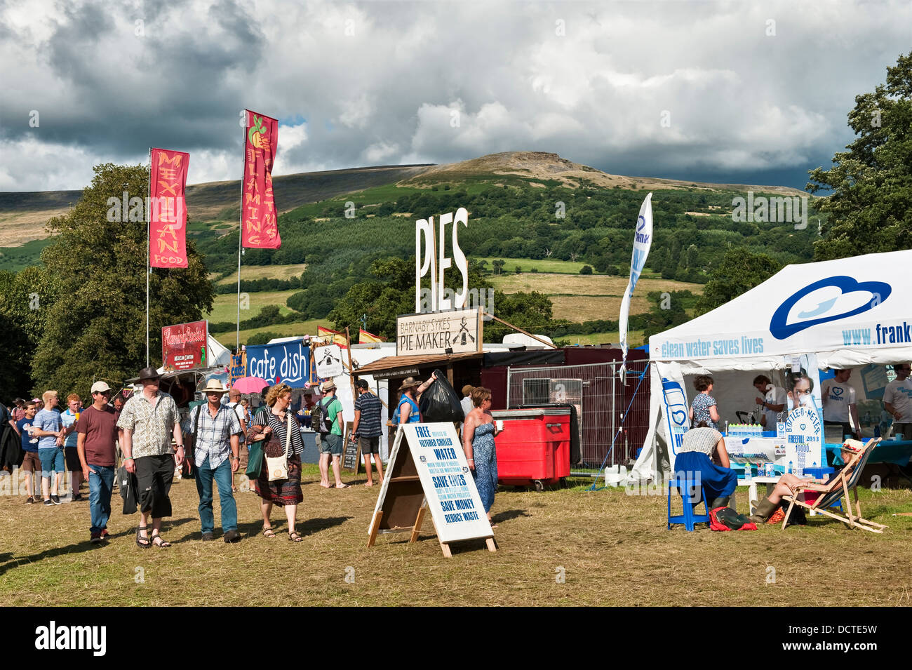 Food stalls against a backdrop of the Black Mountains, at the annual Green Man music festival, Glanusk, Crickhowell, Wales, UK Stock Photo