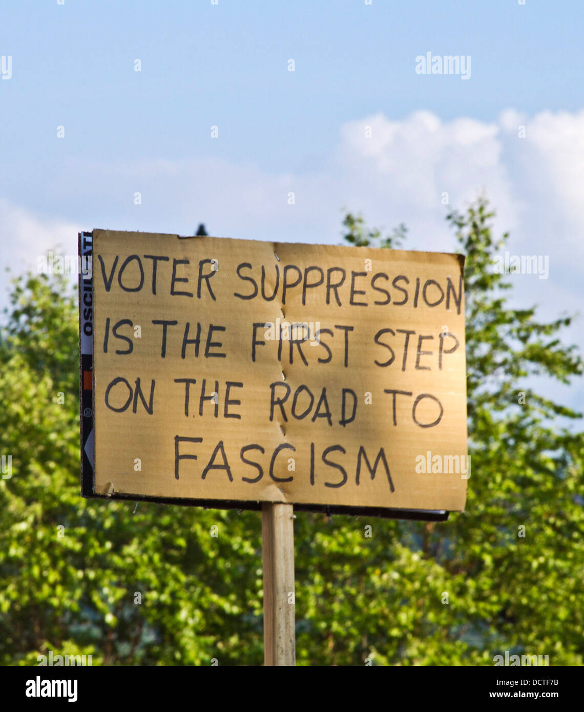 Sign at a Moral Monday rally in Asheville, NC, that reads 'Voter suppression is the first step on the road to Fascism.' Stock Photo