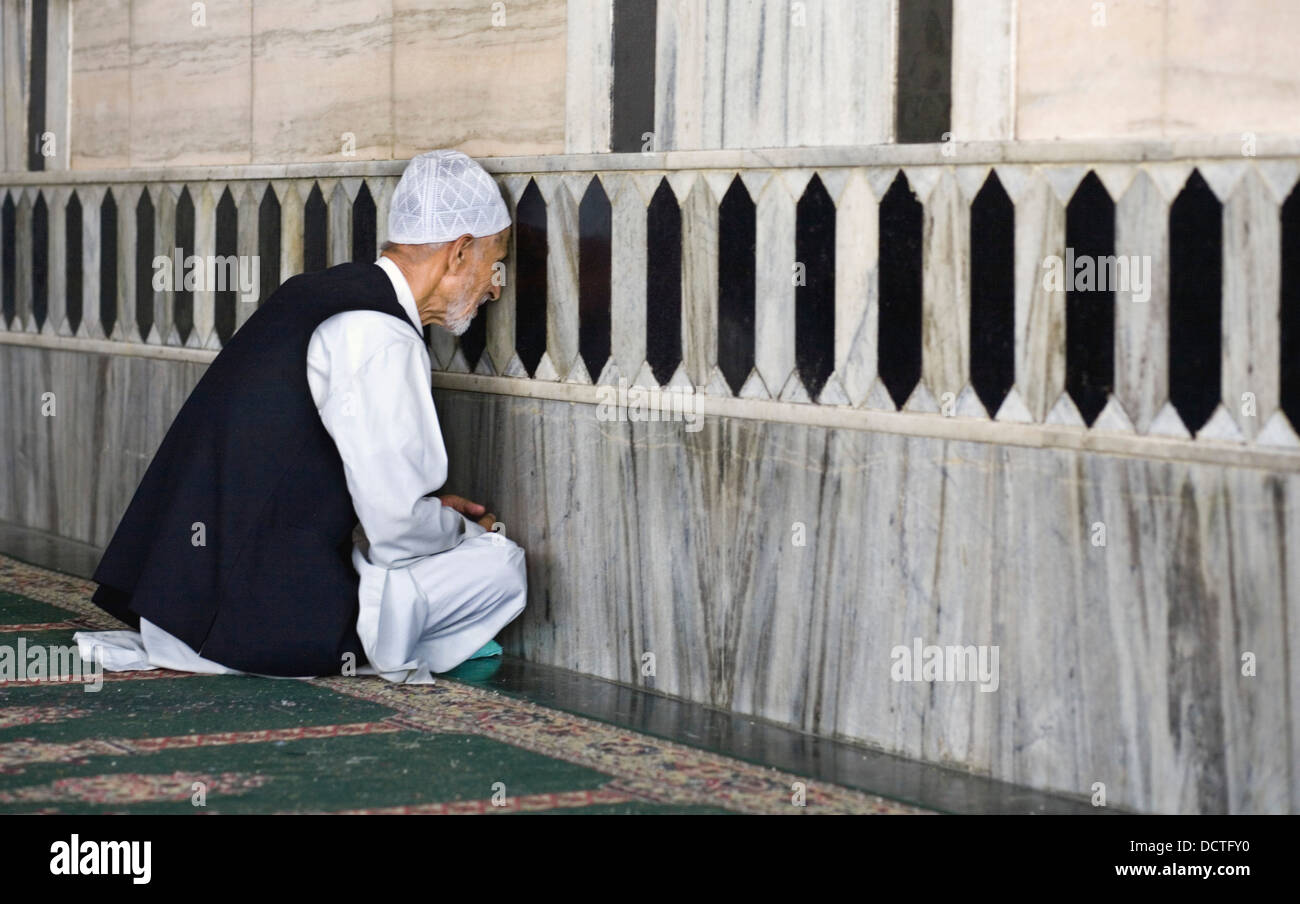 Man Praying; Makhdoom Sahib Shrine, Srinagar, Kashmir, India Stock Photo