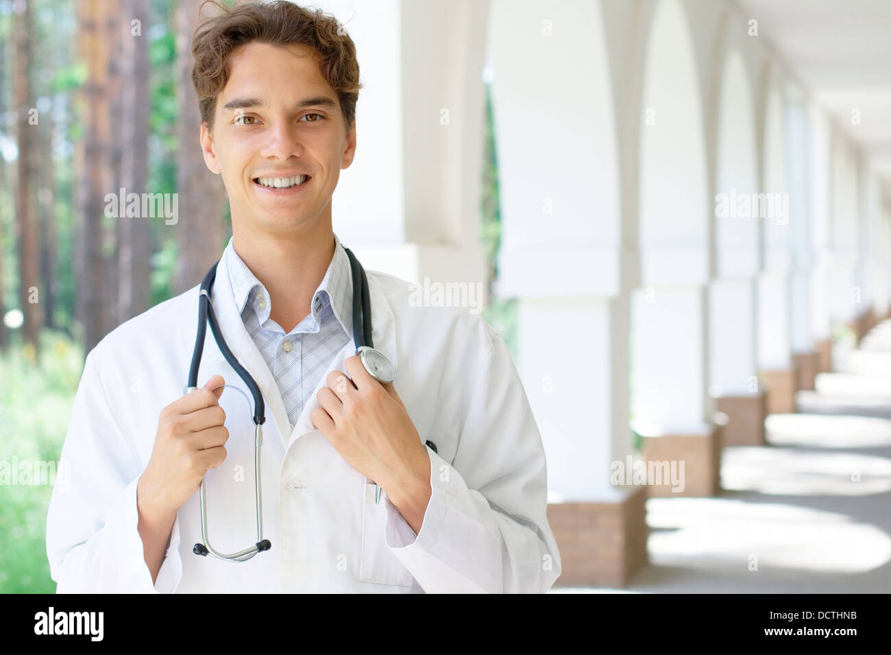 Smiling student white coat hi-res stock photography and images - Alamy