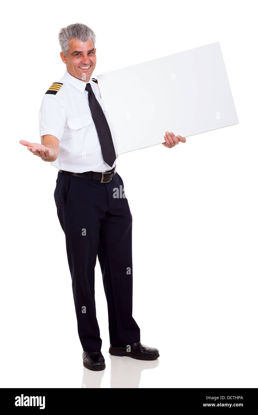 cheerful airline pilot advertising with blank banner Stock Photo