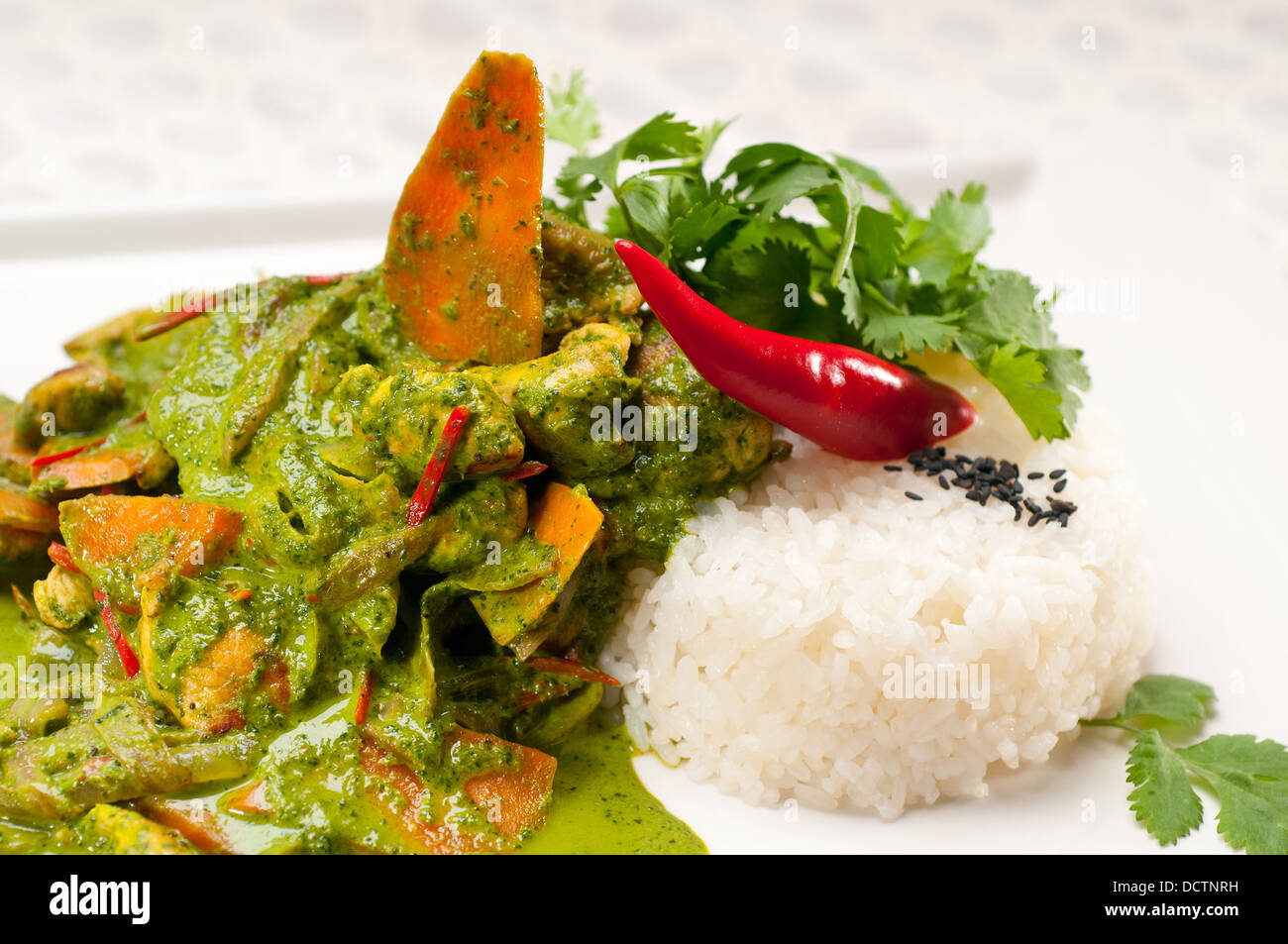 chicken with green curry vegetables and rice Stock Photo