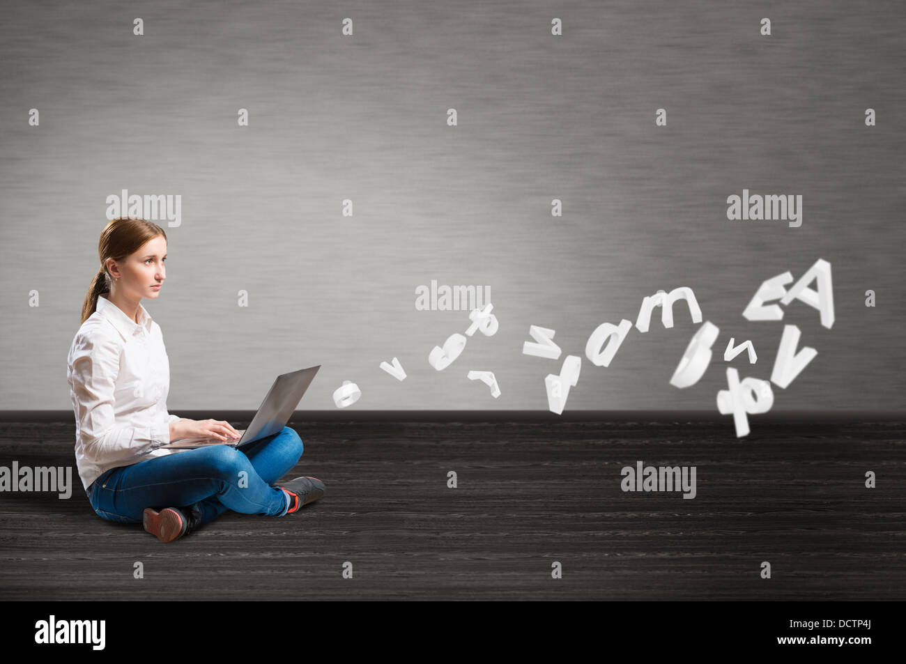 young girl sitting on the floor with a laptop Stock Photo - Alamy