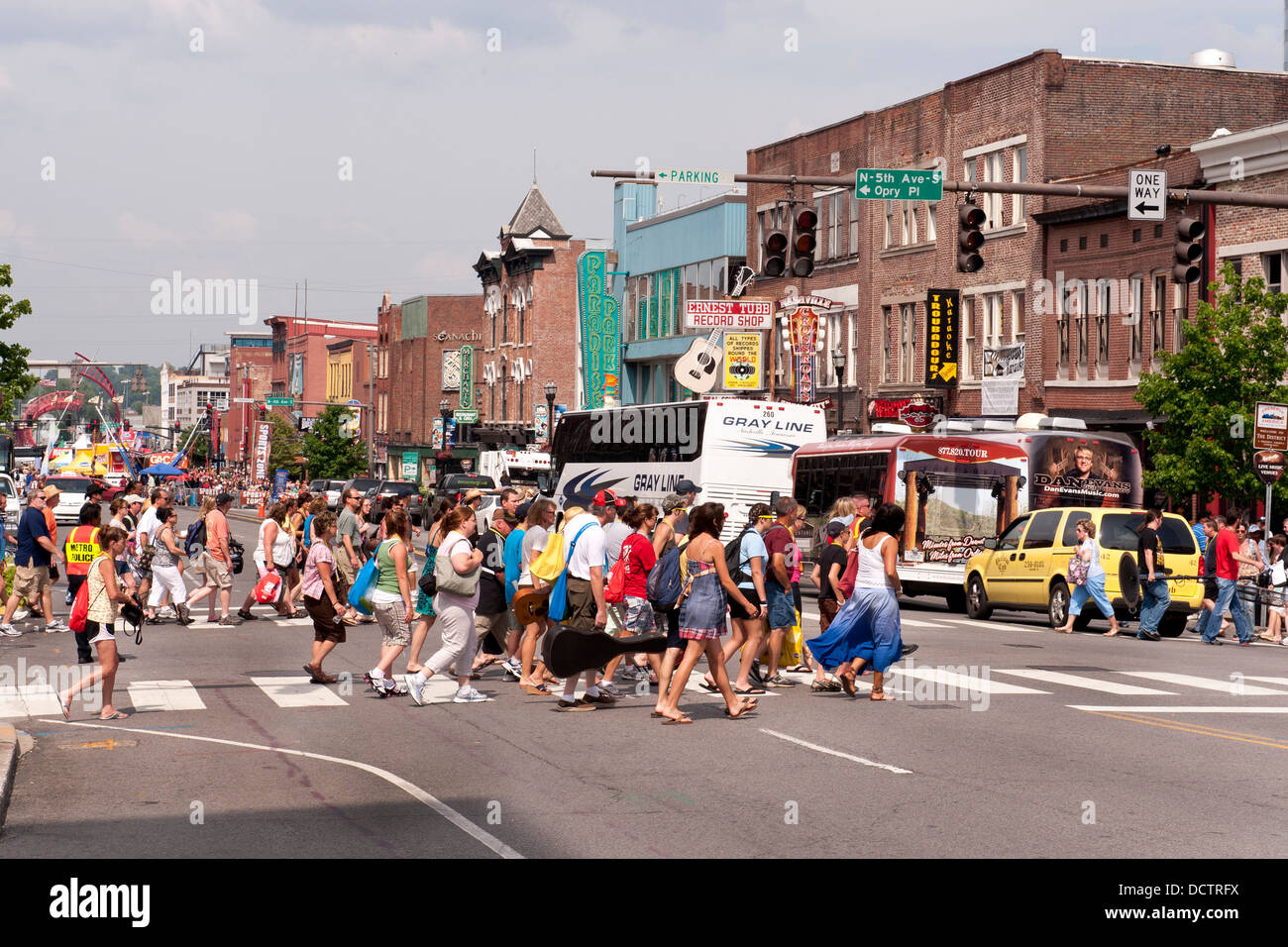 Country music fans crossing lower Broad at Country Music Fest Fan Fair, Nashville, Tennessee Stock Photo