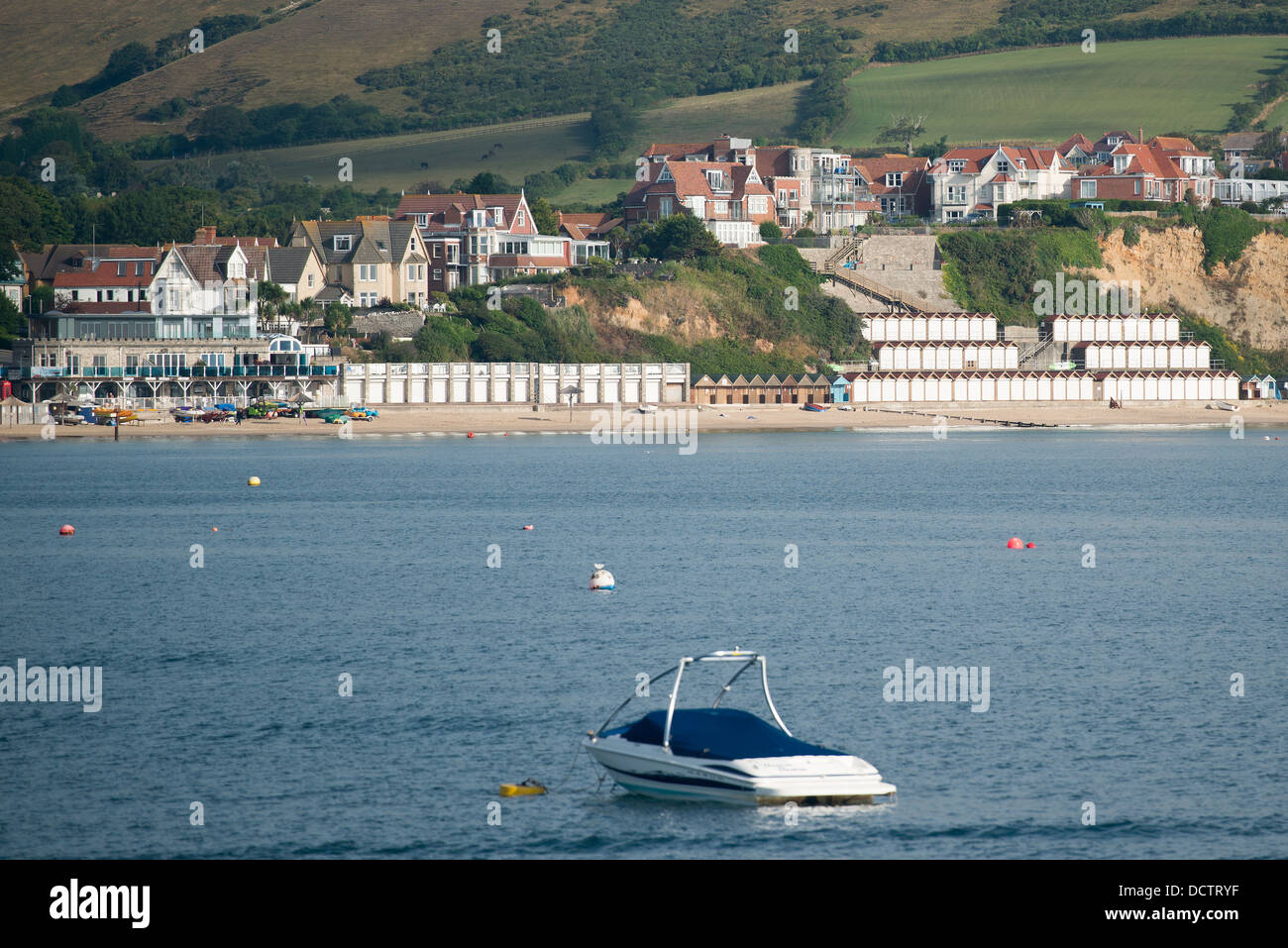 General view across Swanage Bay looking back at the beach, beach huts