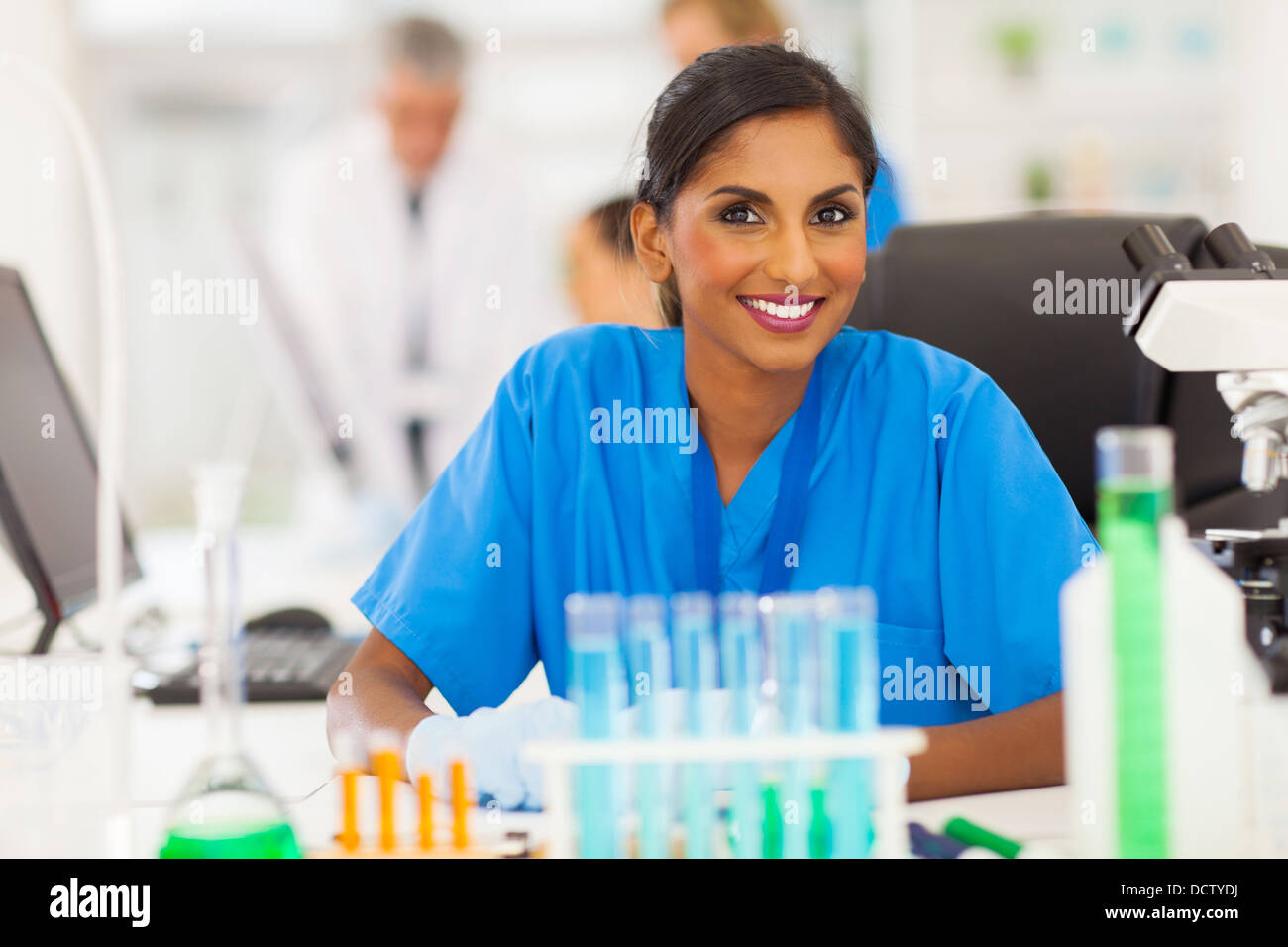 beautiful young Indian researcher working in lab Stock Photo