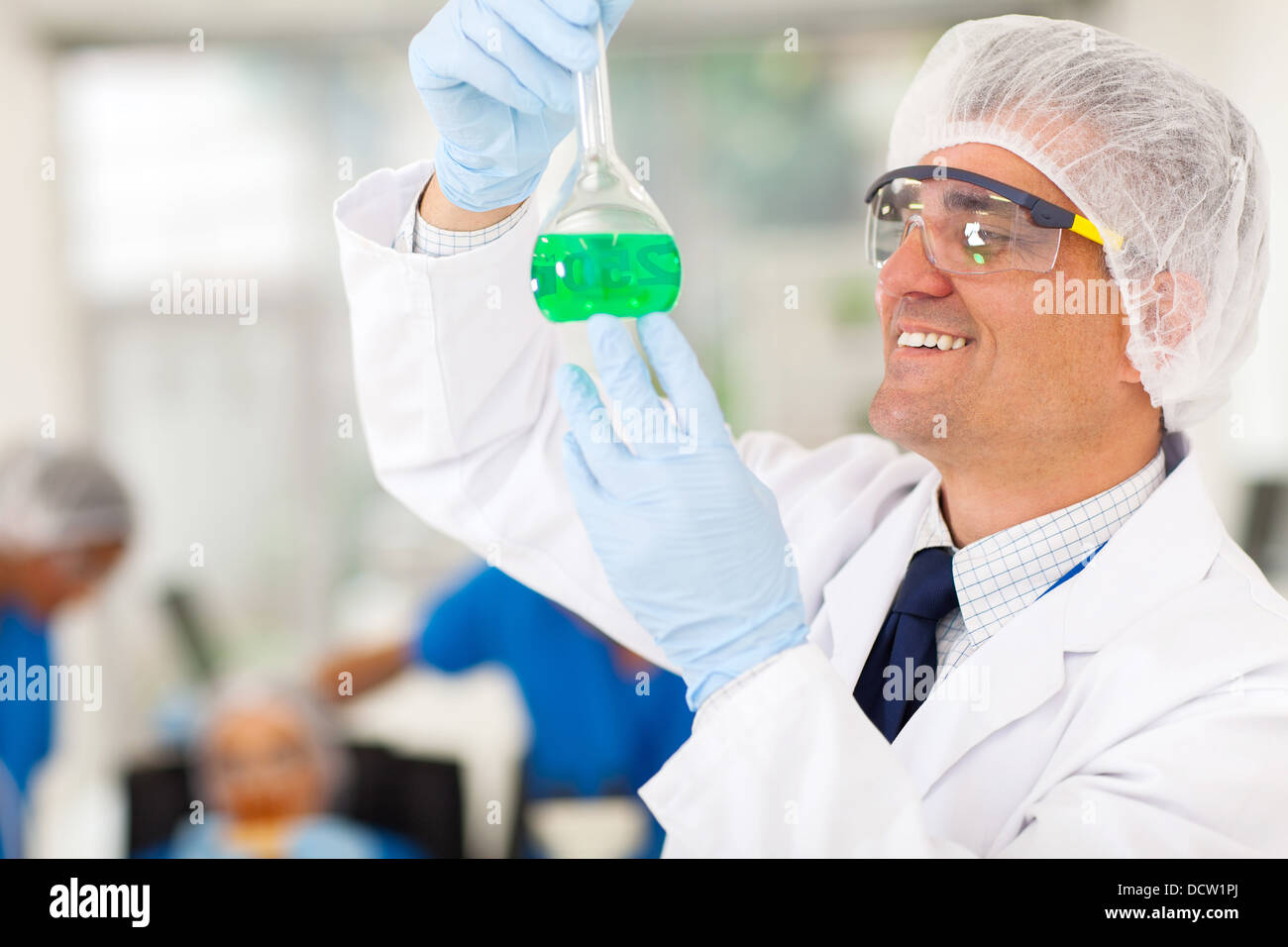 cheerful senior chemist working in lab Stock Photo