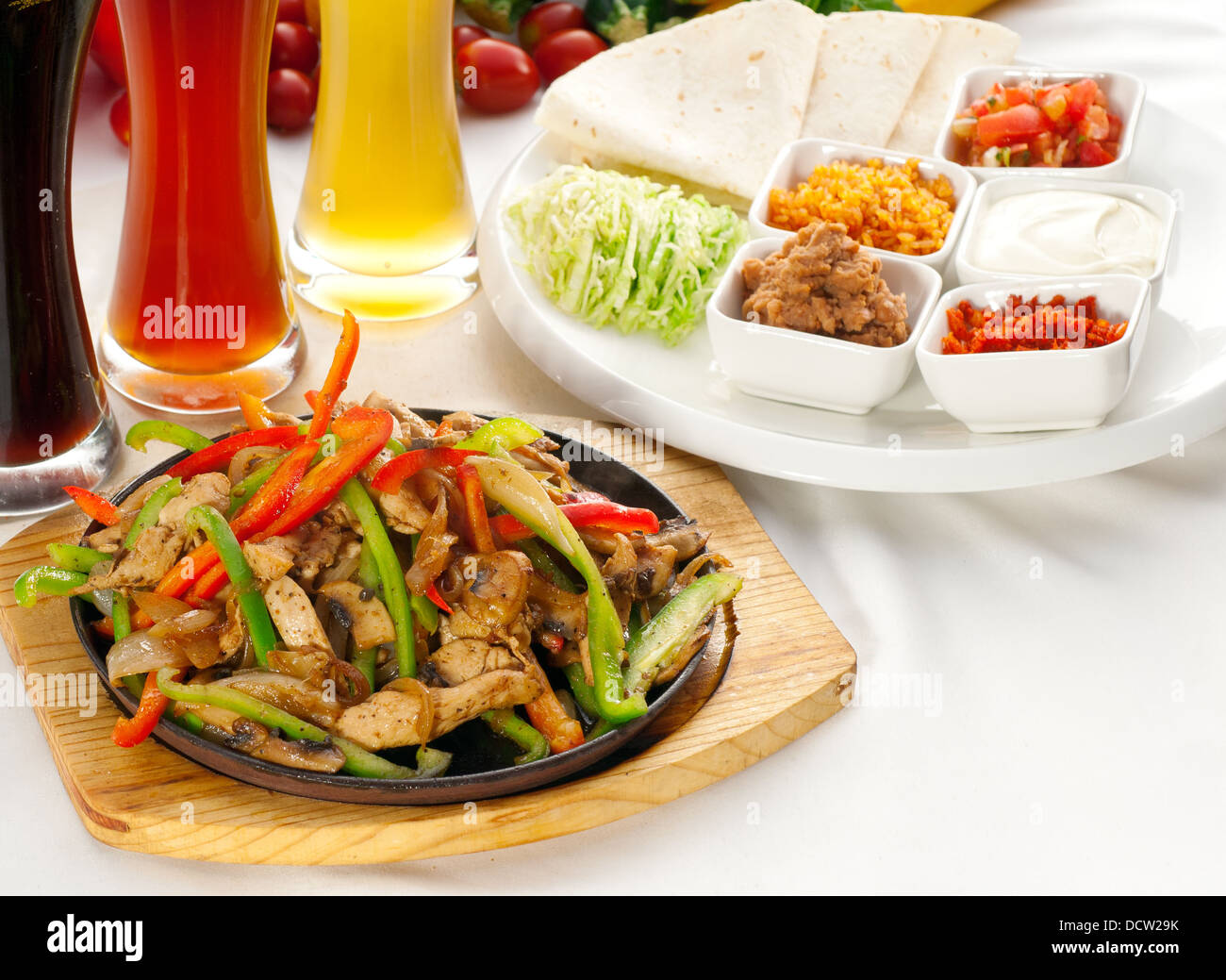 original fajita sizzling hot on iron plate Stock Photo Alamy