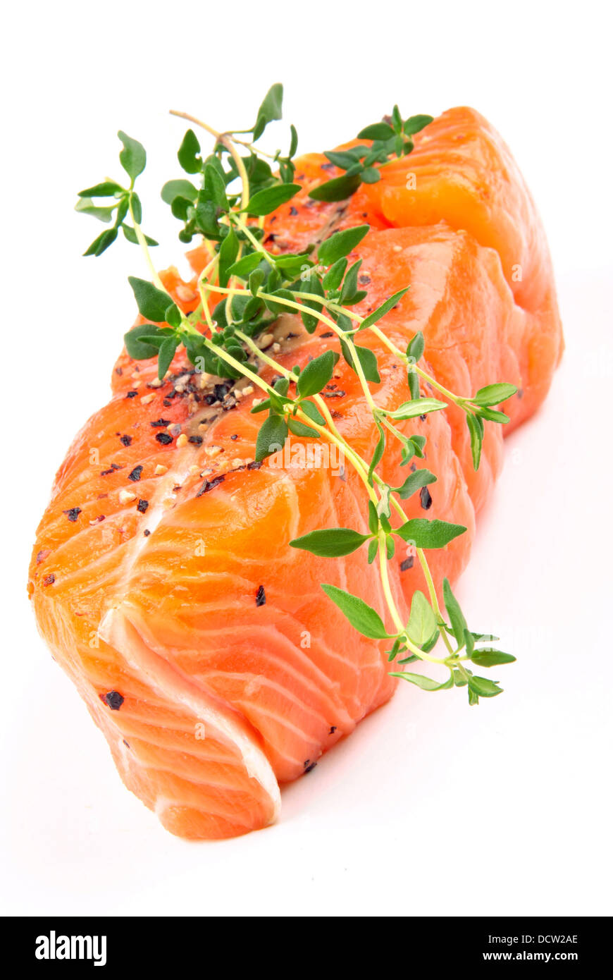 Salmon steak with thyme on a white background Stock Photo Alamy