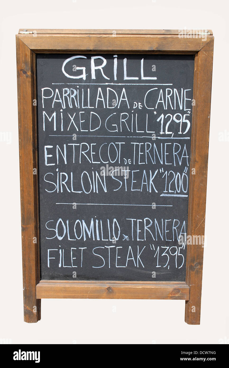 Mixed grill cafe sign on old wooden blackboard. Stock Photo