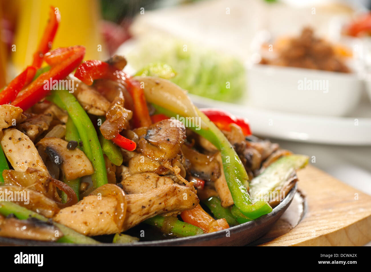 original fajita sizzling hot on iron plate Stock Photo Alamy