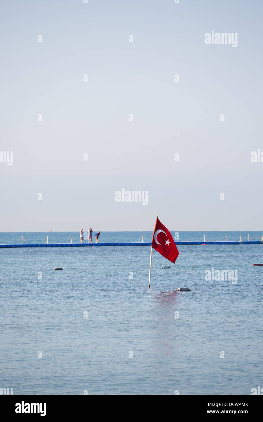 A Turkish flag in a calm blue sea Stock Photo