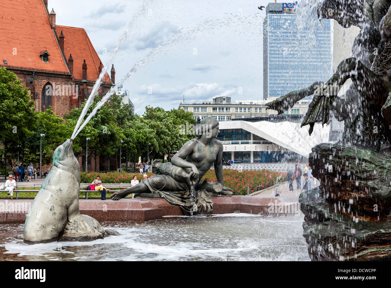 Sculpture of seal spouting water and a woman at the bronze Neptune