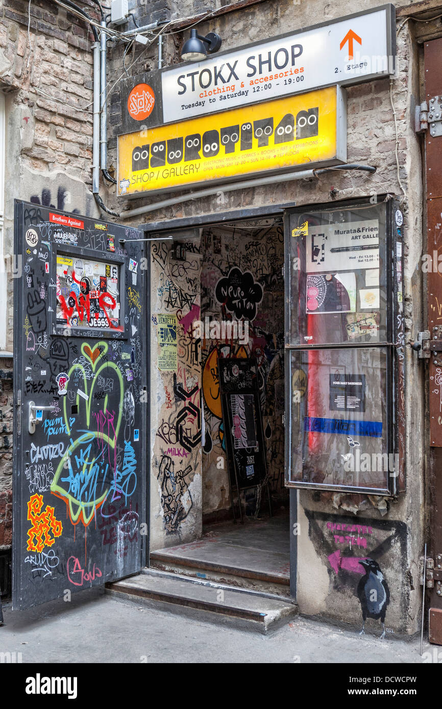 The graffiti covered entrance to the STOKX shop in the inner courtyard of the Haus Schwarzenberg Rosenthaler Strasse Berlin Stock Photo Alamy