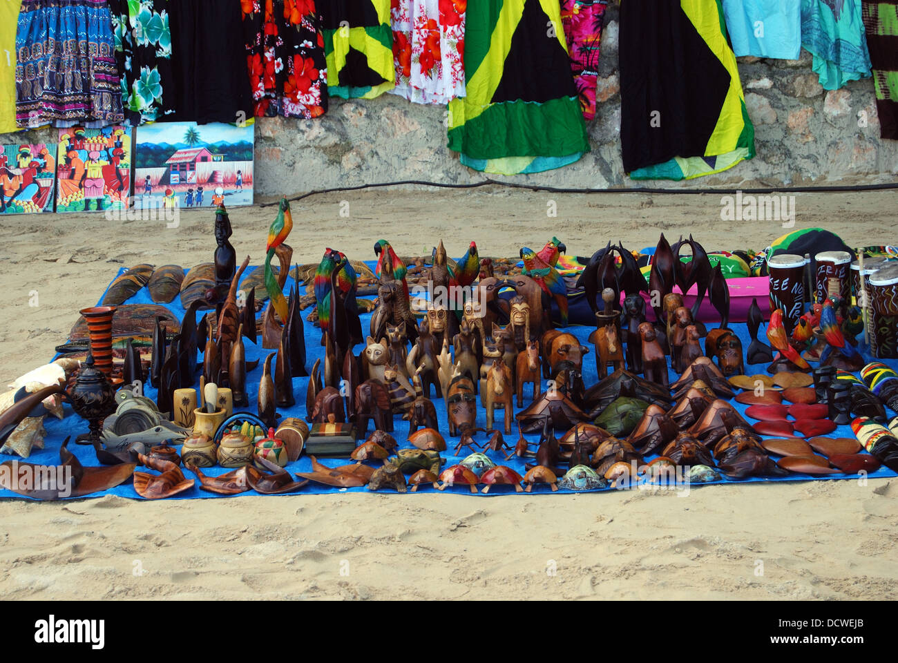 Carved wooden souvenirs for sale on the beach, Ocho Rios, Middlesex County, Jamaica, Caribbean. Stock Photo