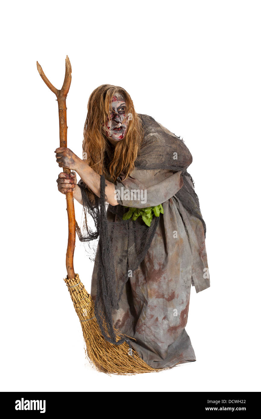 Herbalist or ugly witch with broom Stock Photo
