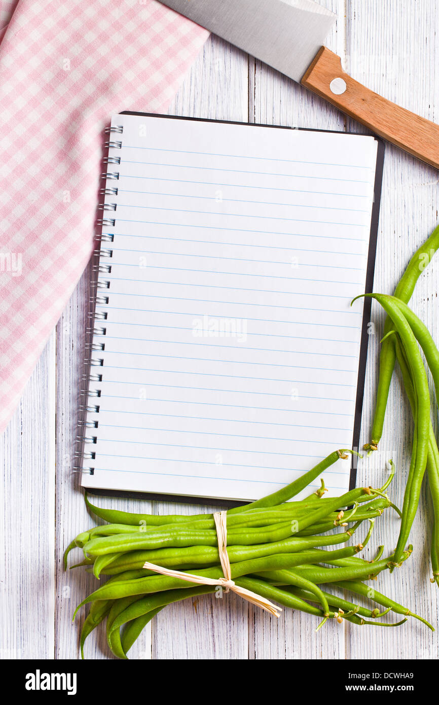 https://c8.alamy.com/comp/DCWHA9/the-blank-recipe-book-with-green-beans-DCWHA9.jpg