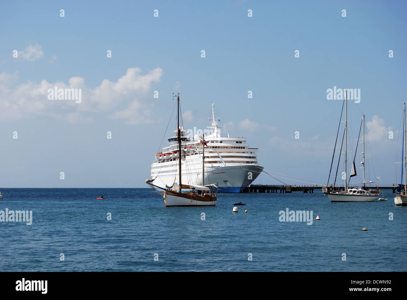 Cruise liner 'Thomson Destiny' alonside quay, with two yachts in foreground, Fort-de-France, Martinique, Caribbean. Stock Photo