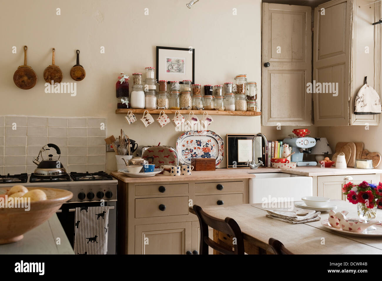 Reclaimed wooden units in Bristol home of British fabric designer Emily Bond Stock Photo
