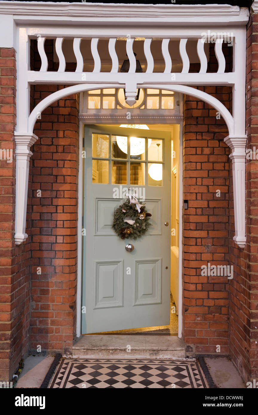 Christmas wreath on front door of North London Victorian conversion Stock Photo