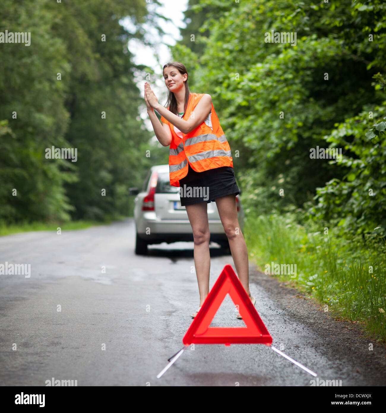 Young female driver after her car has broken down Stock Photo - Alamy