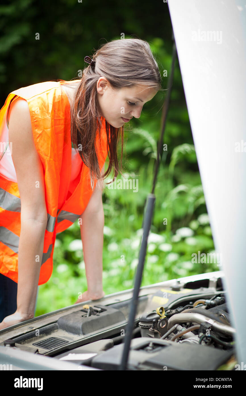 Young female driver after her car has broken down Stock Photo - Alamy