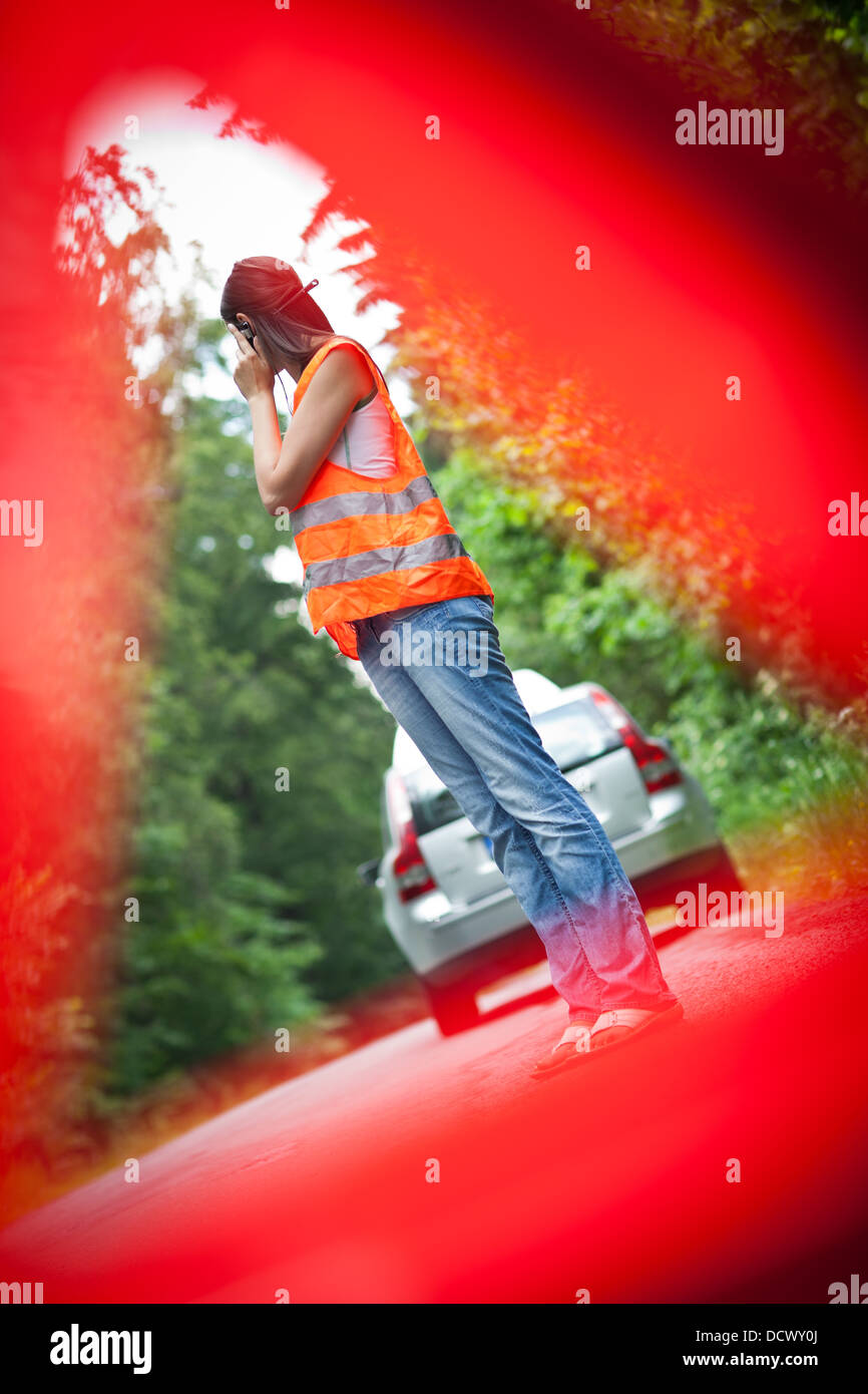 Young female driver after her car has broken down Stock Photo - Alamy