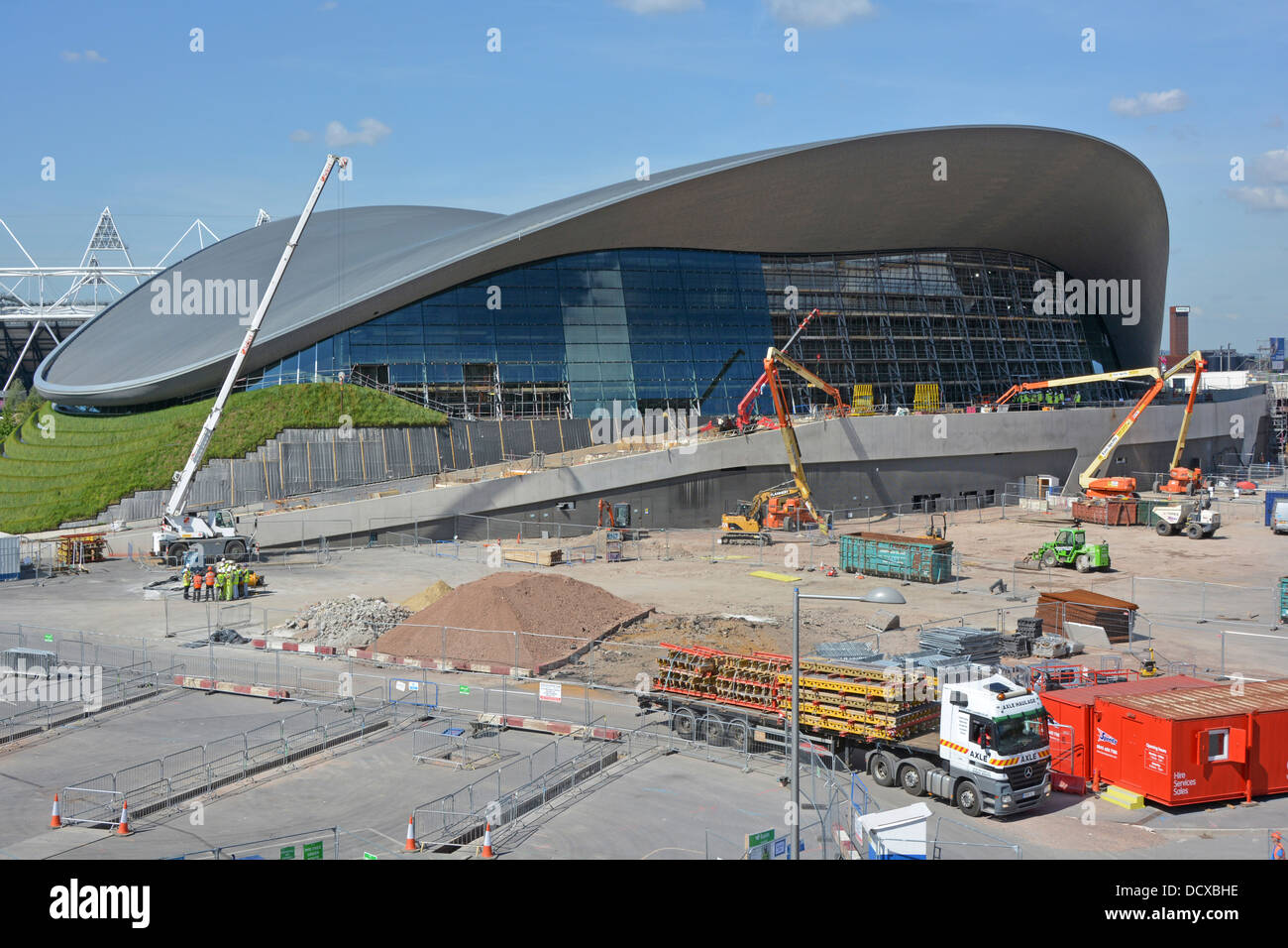 Queen Elizabeth Olympic Park futuristic Aquatic Centre removal of temporary stands showing installation of new side walls Stratford East London UK Stock Photo