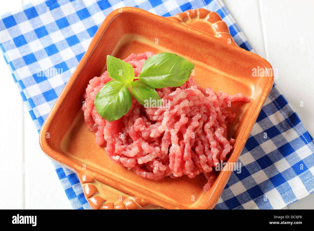Fresh ground meat in terracotta casserole dish Stock Photo Alamy