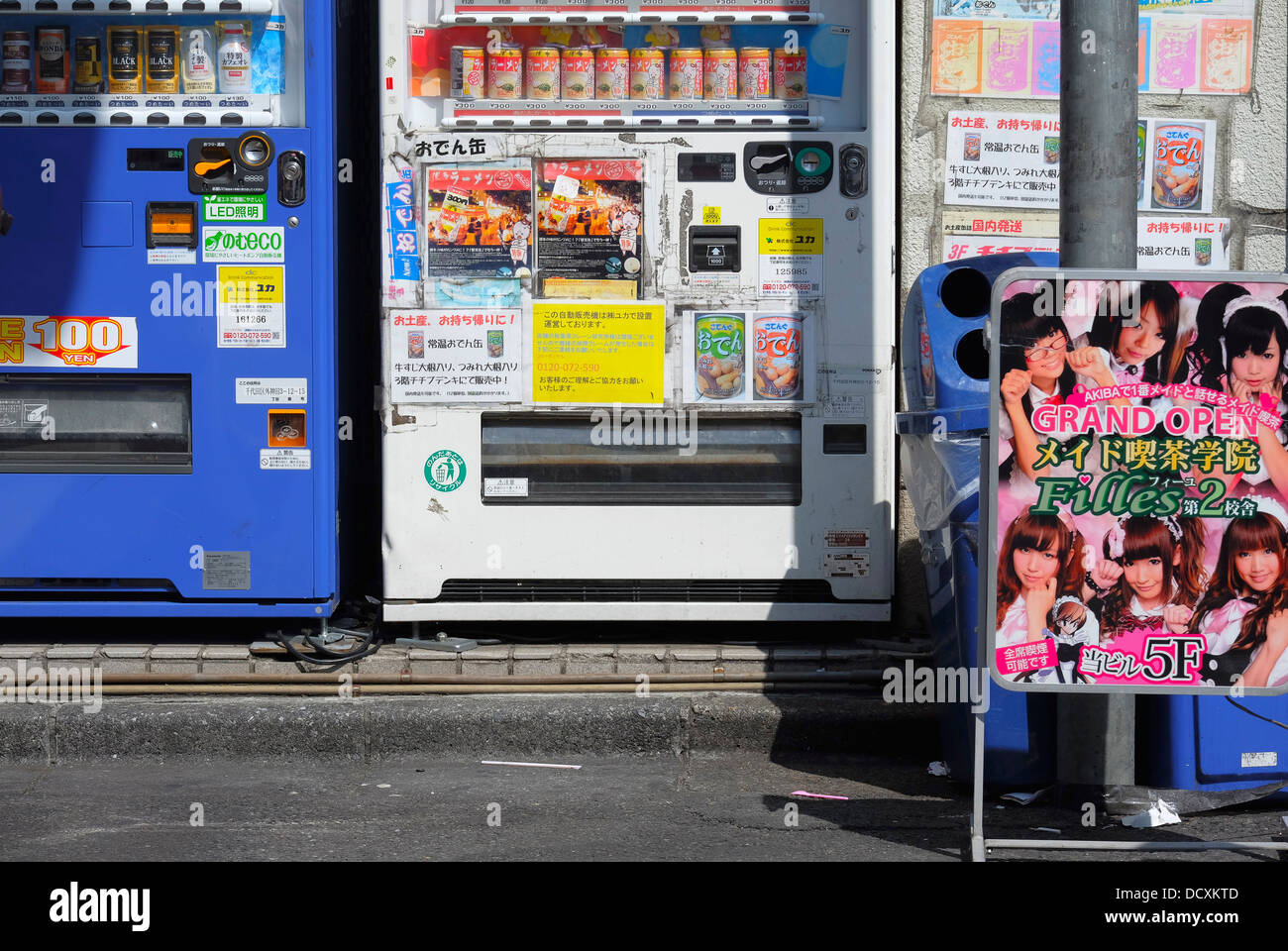 Vending machines and Maid cafe sign in Akihabara Stock Photo