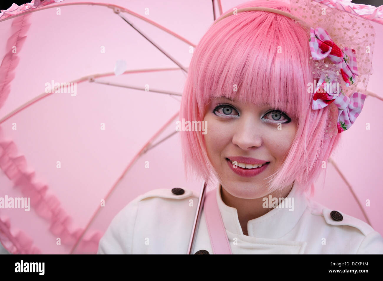 Pink girl with pink umbrella Stock Photo Alamy