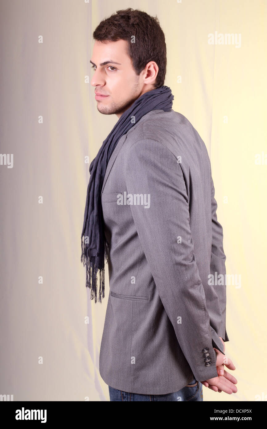 View of a young man standing against a white background Stock Photo - Alamy