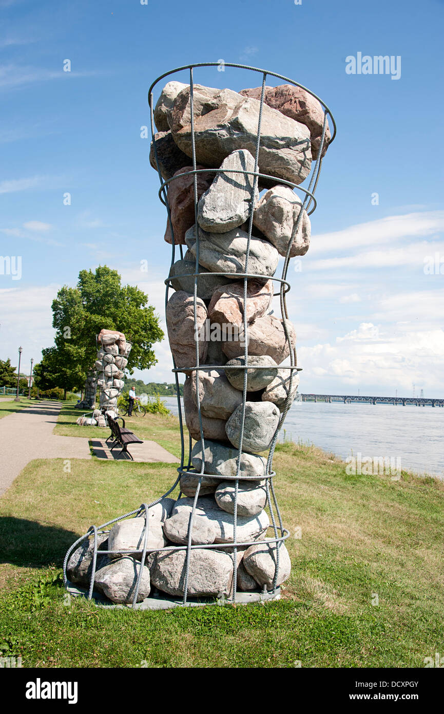 Montreal. Structure of a leg and foot filled with large stones displayed near La Chine canal in Rene Levesque Park. Stock Photo