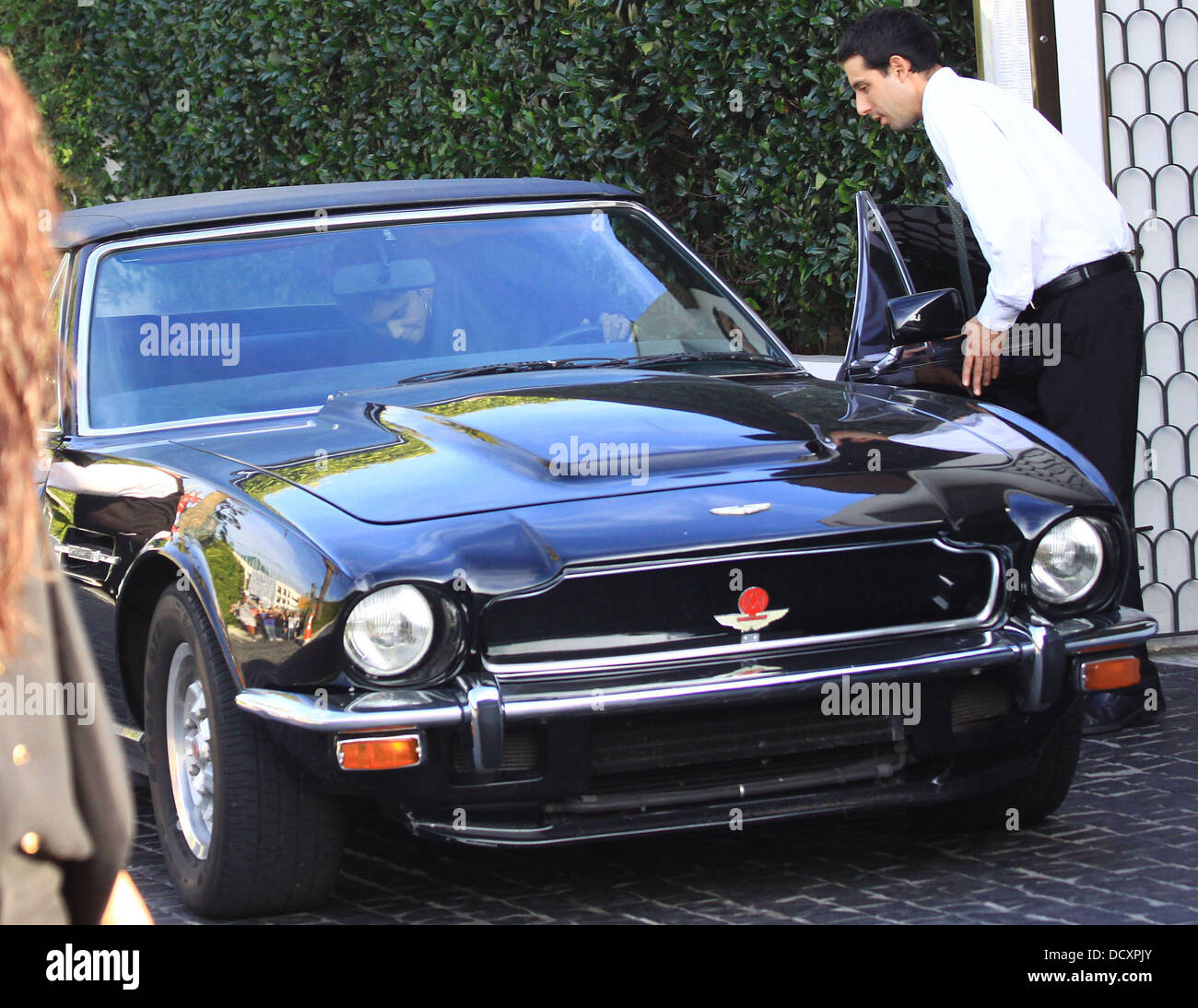 Halle Berry leaves in a black Aston Martin V8 Vantage Volante after having lunch in West Hollywood. Los Angeles, California - 29.12.11 Stock Photo