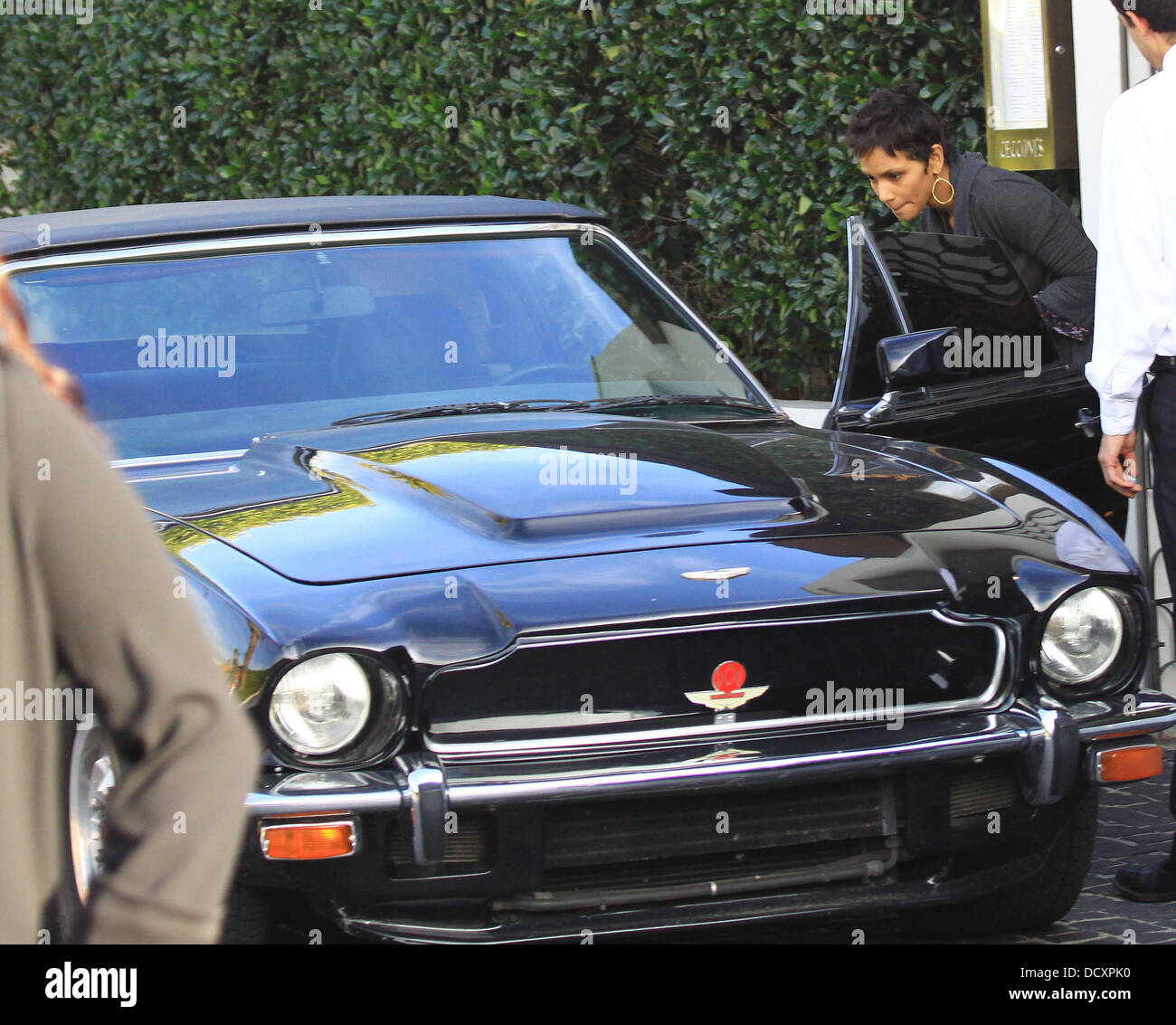 Halle Berry leaves in a black Aston Martin V8 Vantage Volante after having lunch in West Hollywood. Los Angeles, California - 29.12.11 Stock Photo
