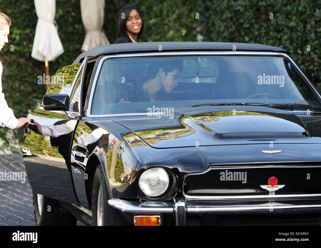 Halle Berry leaves in a black Aston Martin V8 Vantage Volante after having lunch in West Hollywood. Los Angeles, California - 29.12.11 Stock Photo