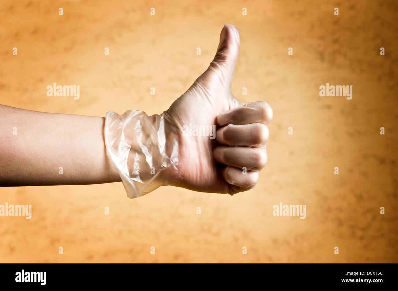 Hand in glove thumbs up hi-res stock photography and images - Alamy