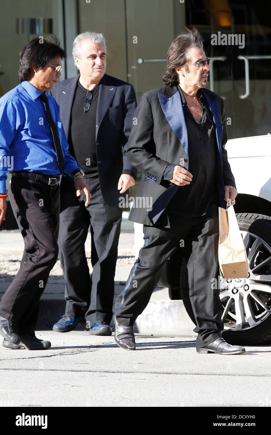 A dishevelled Al Pacino wearing an ill-fitting, blue satin, trimmed