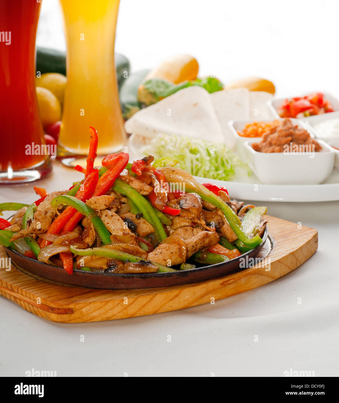 original fajita sizzling hot on iron plate Stock Photo Alamy