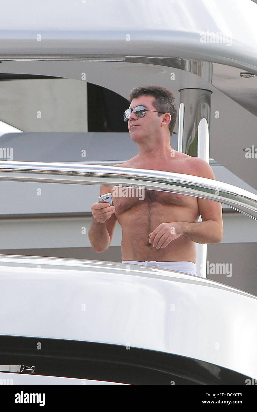 Simon Cowell relaxes onboard the luxury super yacht, MY Slipstream. St