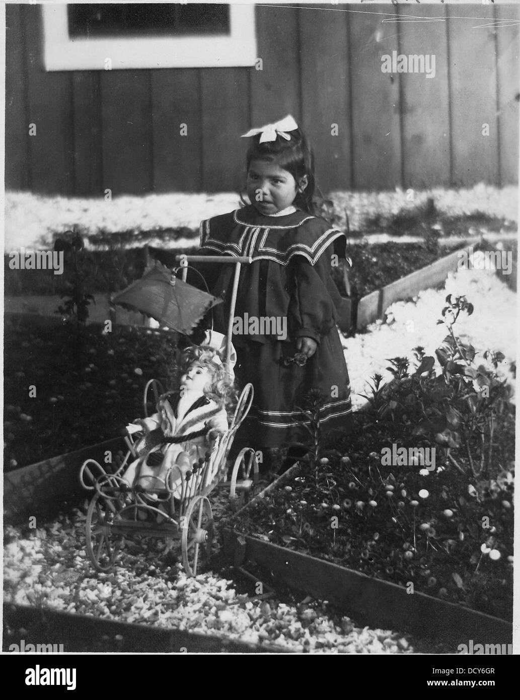 Indian girl with doll in buggy 297484 Stock Photo Alamy