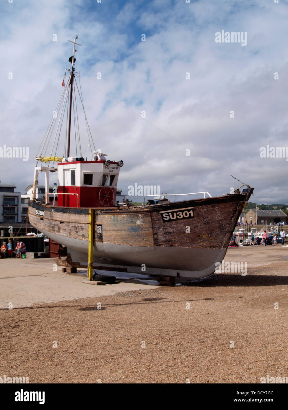 Small commercial fishing boat on the quay, West Bay, formerly known as Bridport Harbour, Dorset, UK 2013 Stock Photo