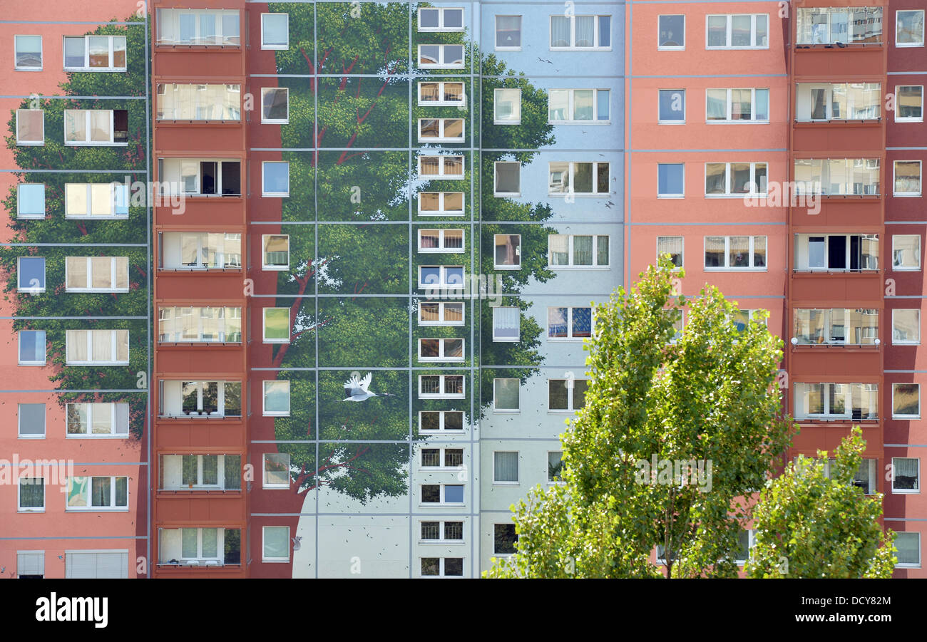 A view of a facade of an apartment building located in the district Lichtenberg and that was painted by artists 'Citecreation' from Lyon, France, for the Berlin housing cooperative Solidarität eG in the last three years is pictured in Berlin, Germany, 22 August 2013. Several large blocks of houses were re-designed creating the larges wall painting in the world, according to Citecreation. Photo: BERND VON JUTRCZENKA Stock Photo